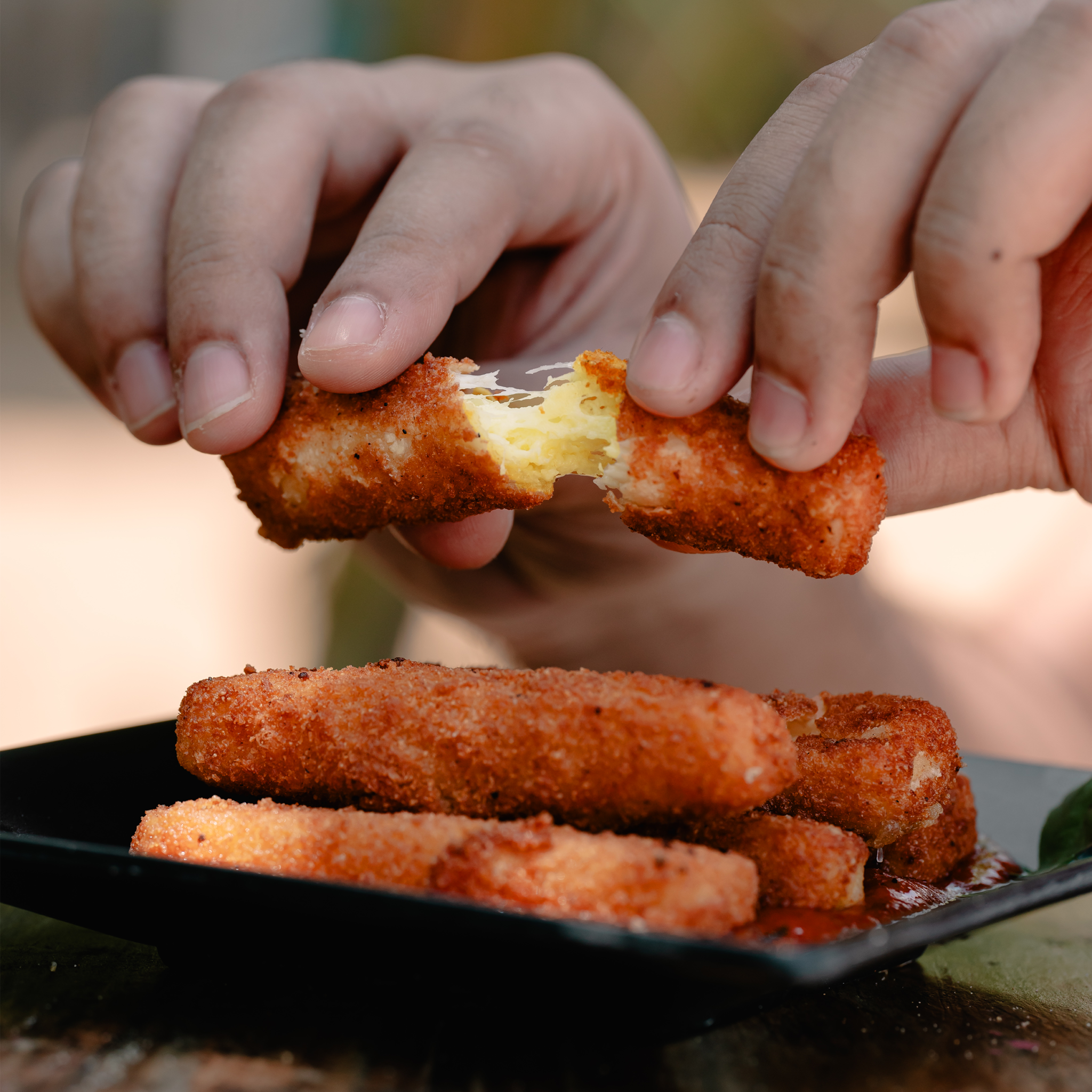 Mozzarella sticks, cheese pull